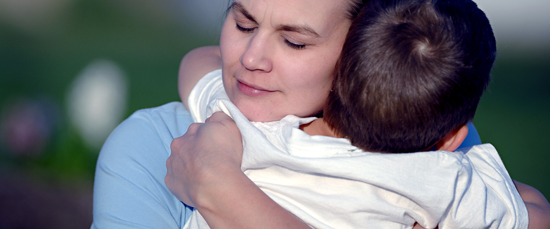 Mom Hugging Child