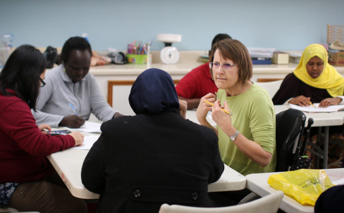 Volunteer teaching Citizenship class at the RAIS Welcome Center.