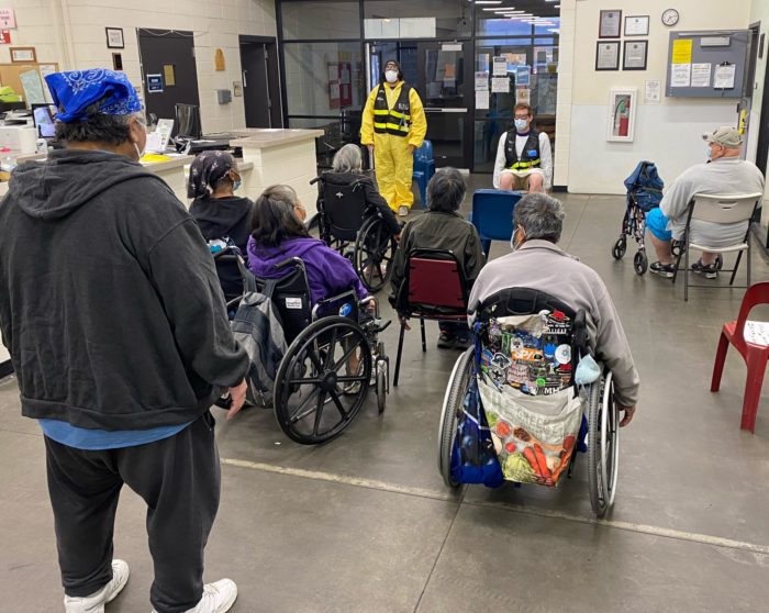 Group of people stretching during a program at Brother Francis Shelter