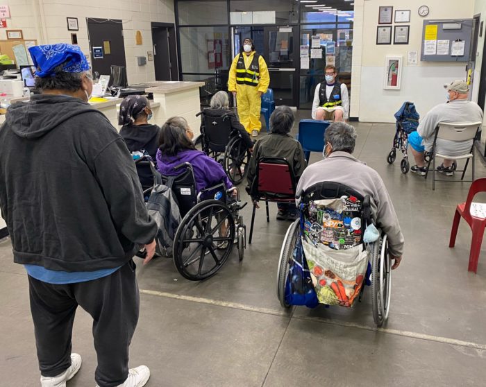 Group of people stretching during a program at Brother Francis Shelter