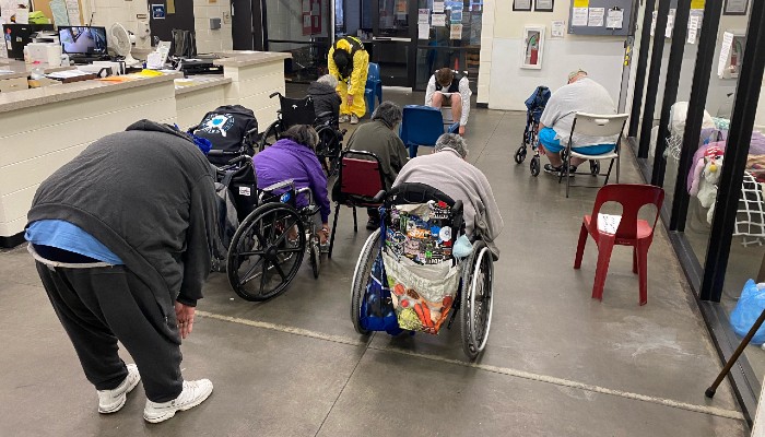 Guests stretching at Brother Francis Shelter